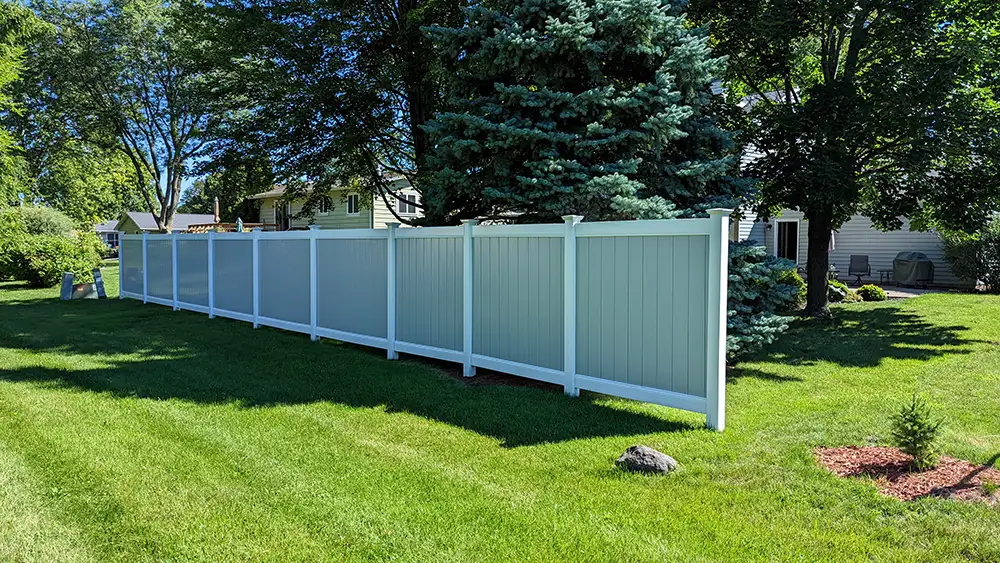 Vinyl fence in a residential neighborhood.