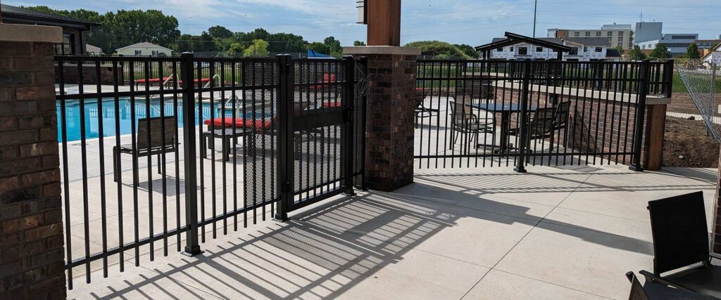Ornamental security fence around a swimming pool.