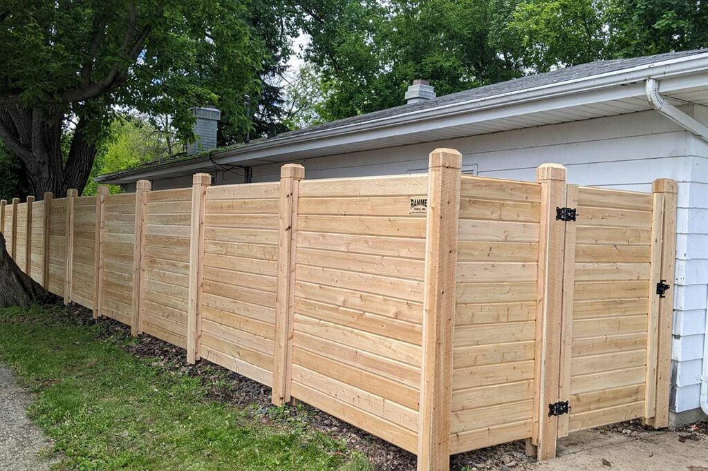 Custom cedar wood fence with a gate.
